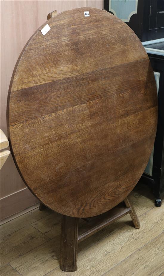 An early 19th century oak tilt top table, W.111cm